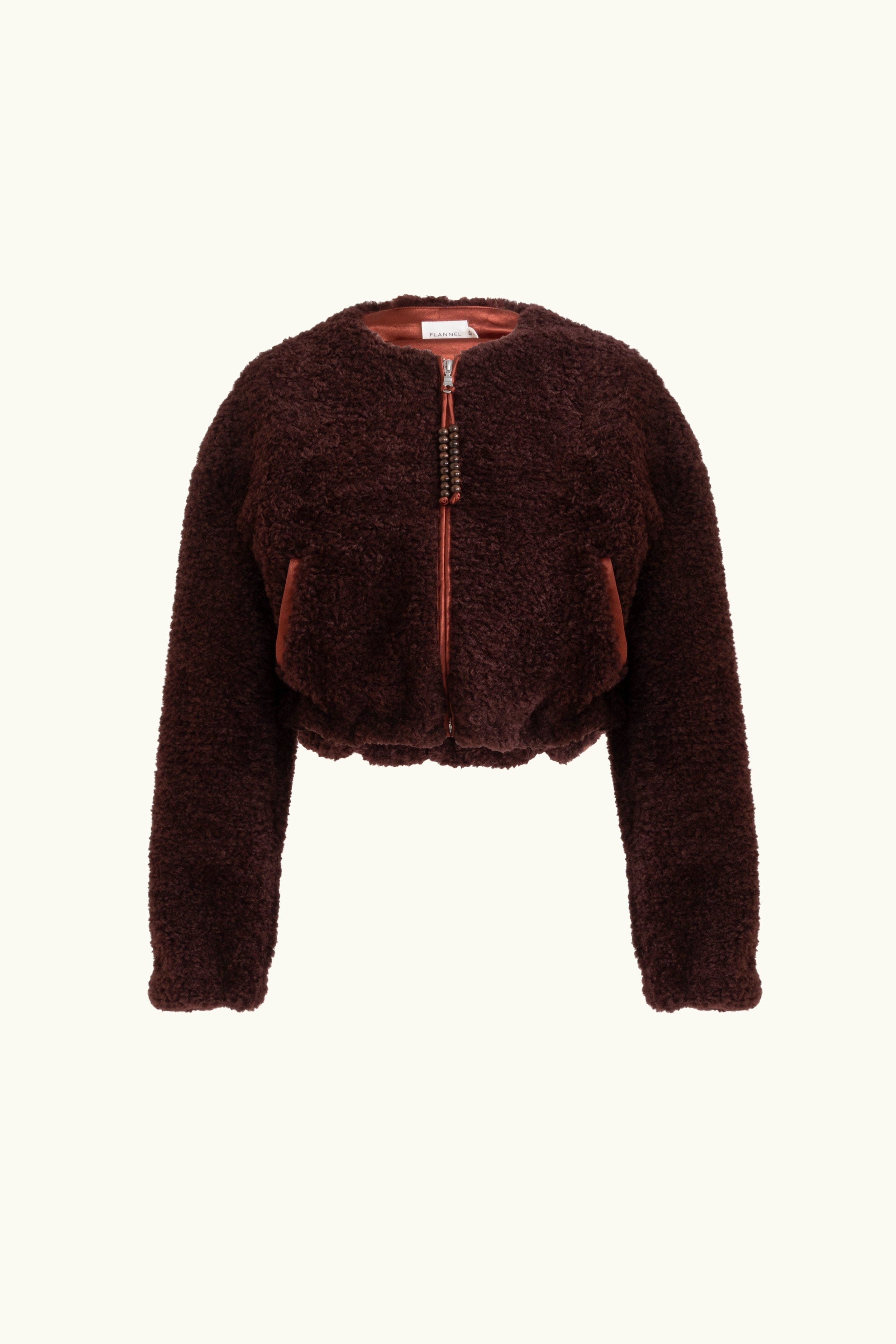 Port coloured faux fur zip up jacket with beaded tassel zip on a white background