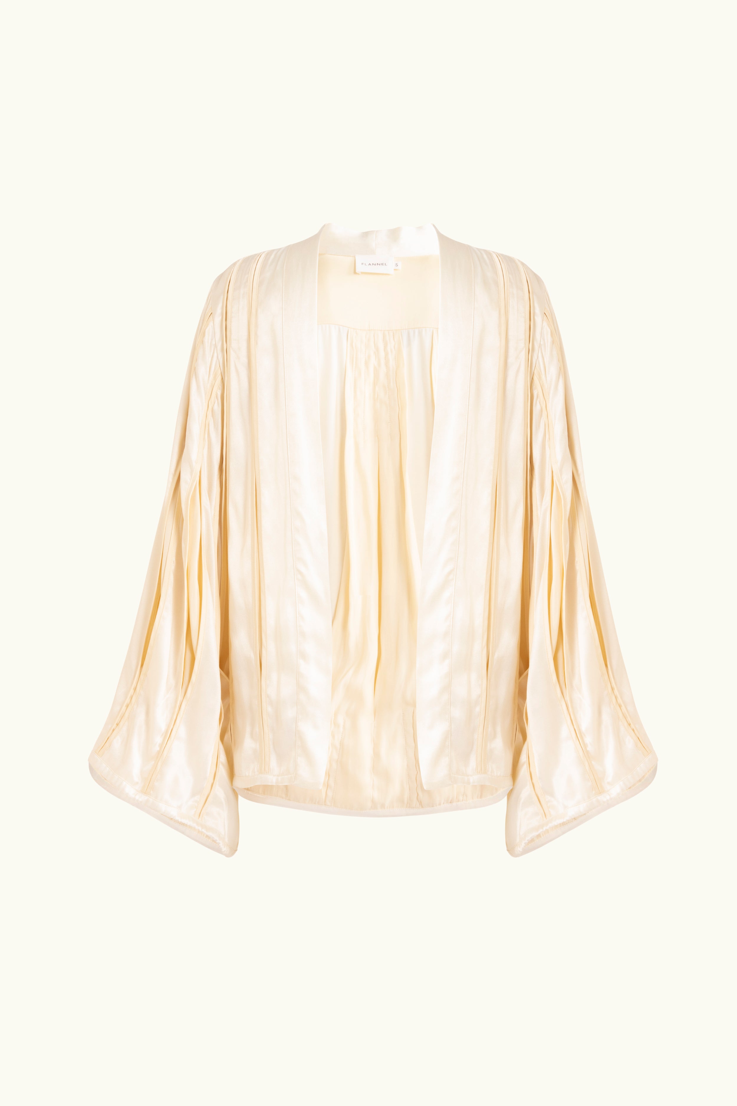 Cream box pleat jacket on white background