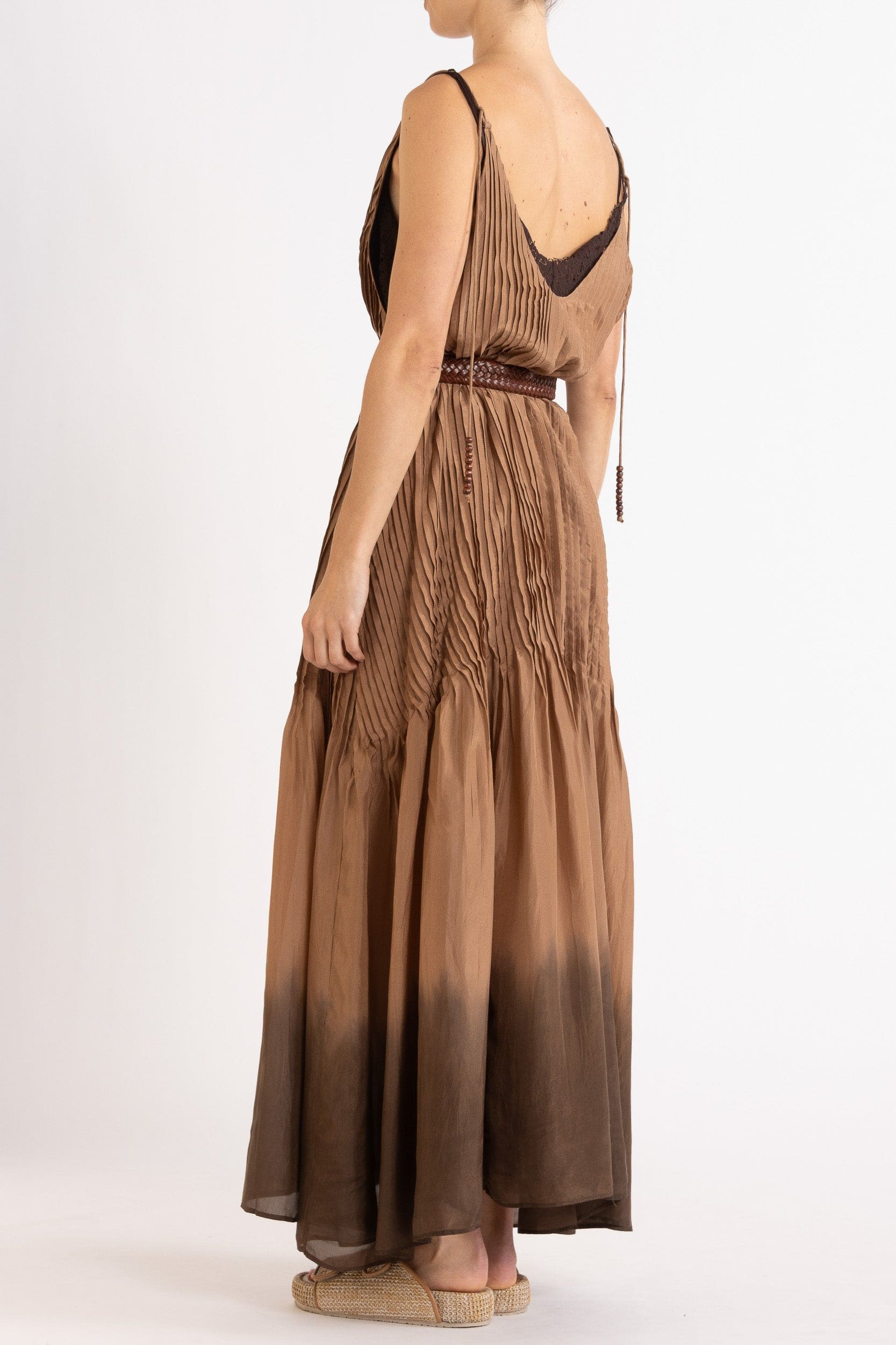 Model wearing mocha dip-dye silk cami dress & brown plaited leather belt, back-side view
