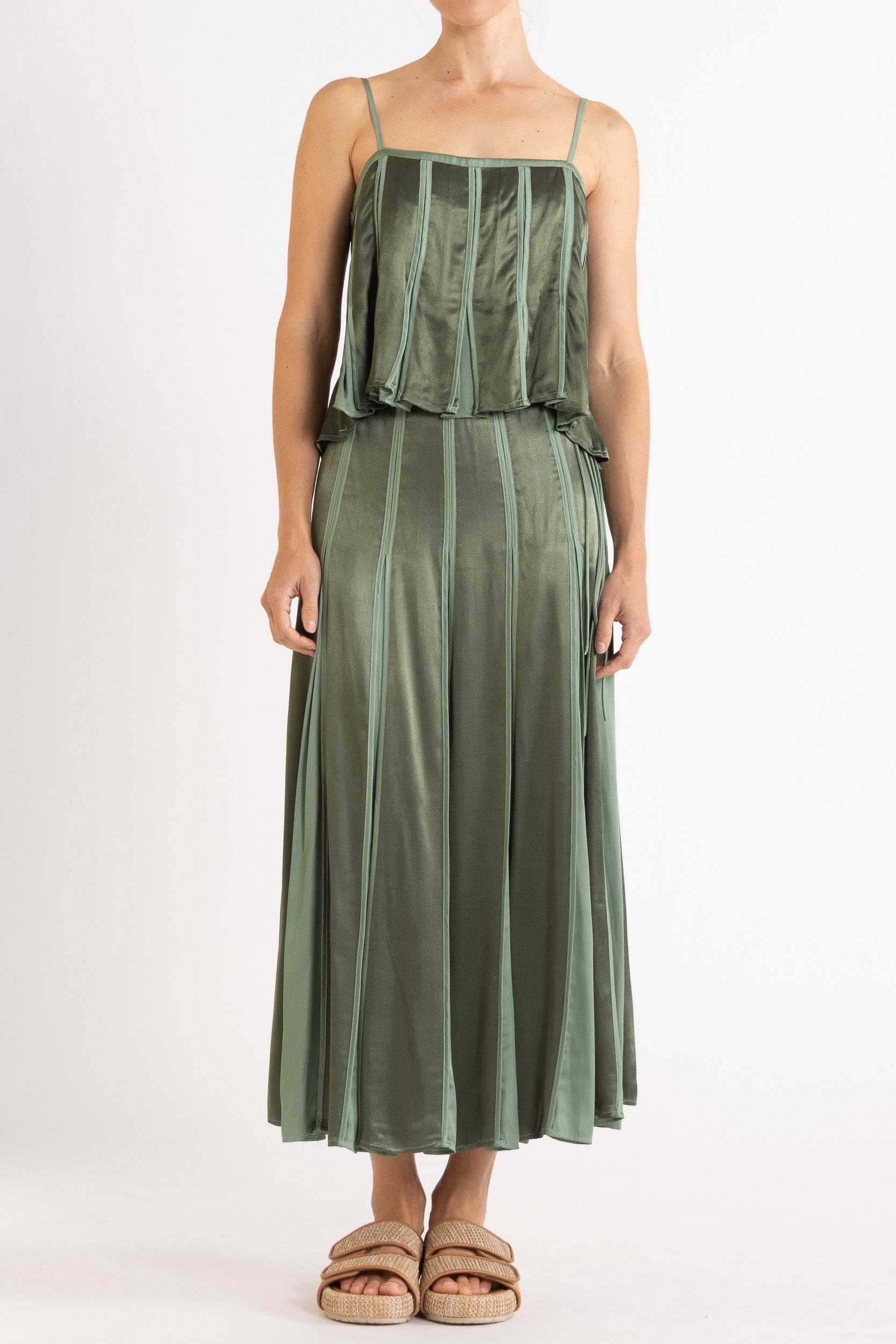 Model wearing olive green box pleat camisole & skirt, front view