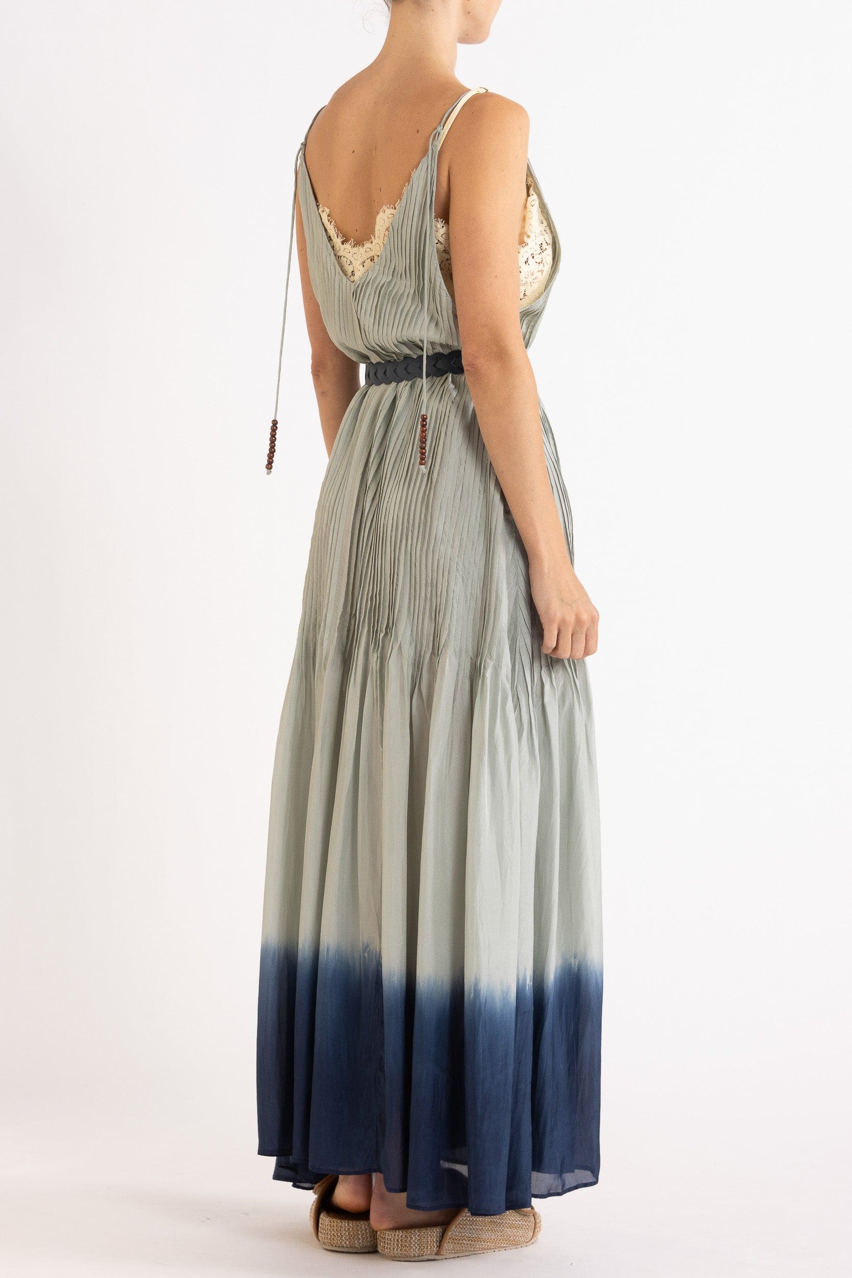 Model wearing sky blue dip-dye silk cami dress & belt, back-side view