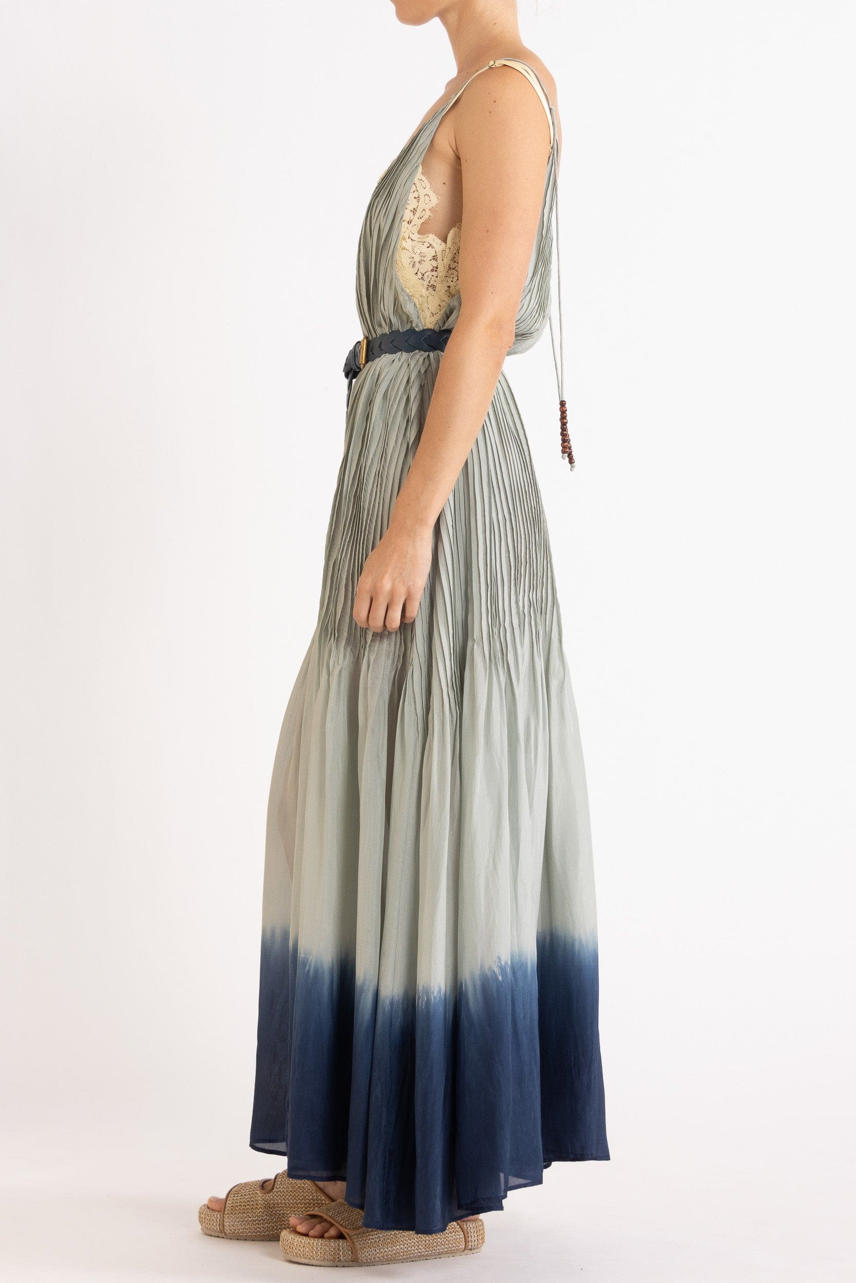 Model wearing sky blue dip-dye silk cami dress & belt, side view