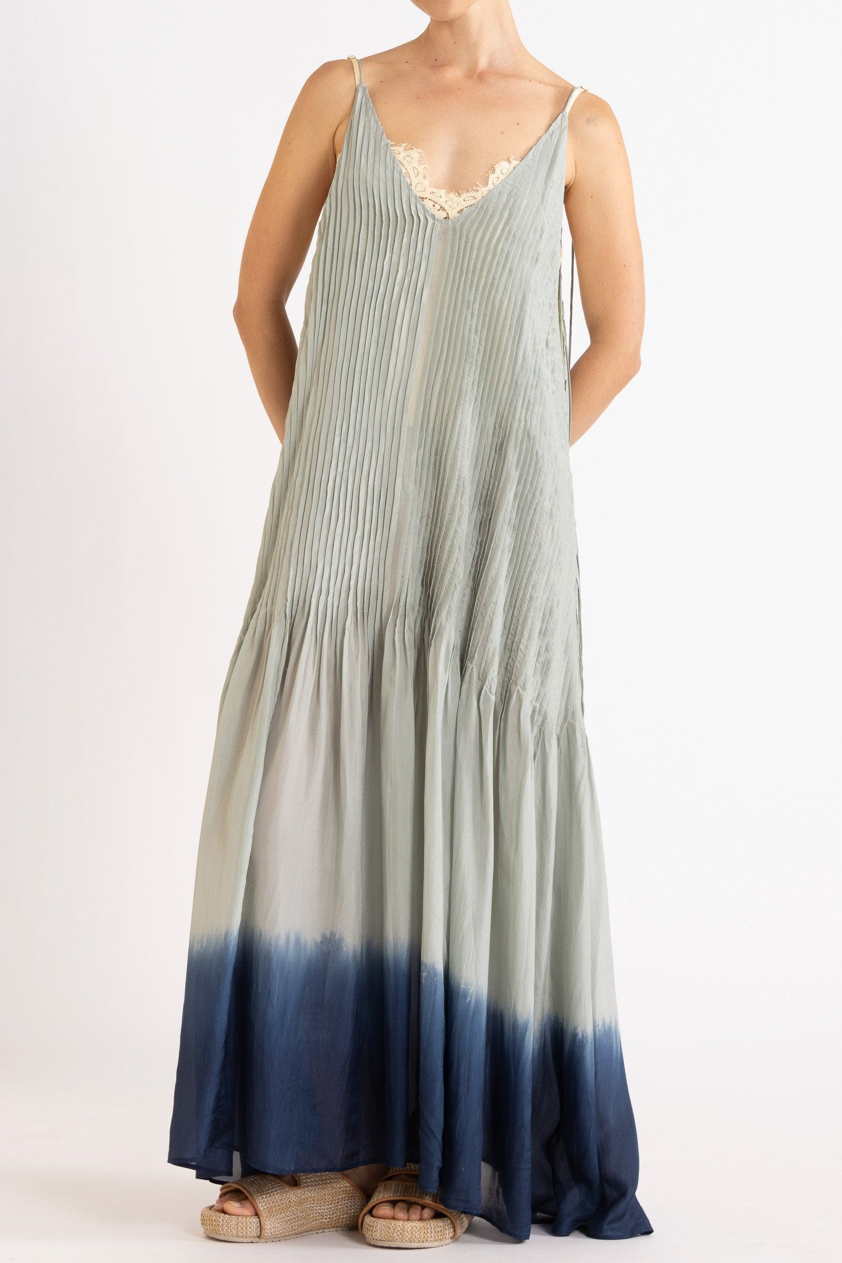 Model wearing sky blue dip-dye silk cami dress, front view