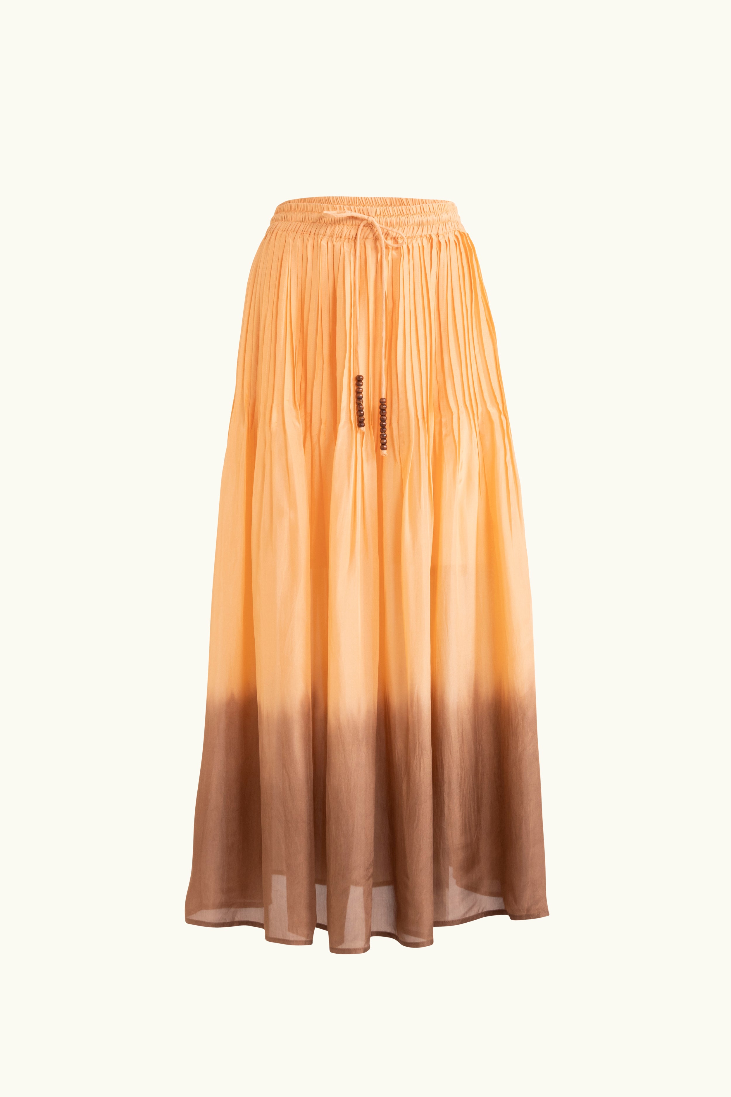 Peach dip-dye silk skirt on a white background