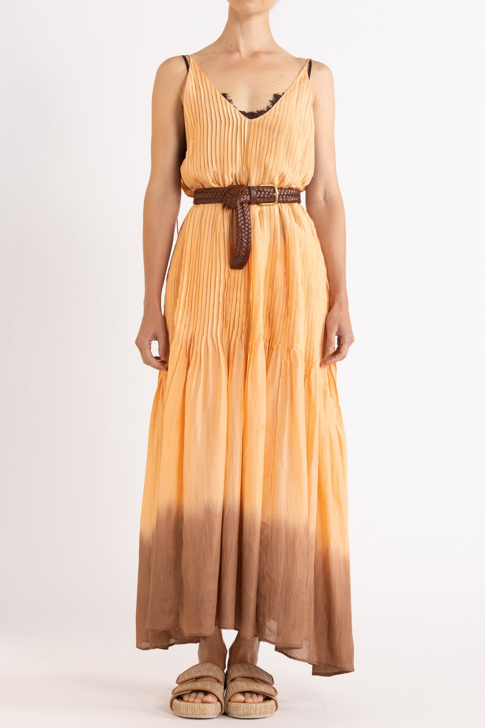 Model wearing peach dip-dye silk cami dress & brown plaited leather belt, front view