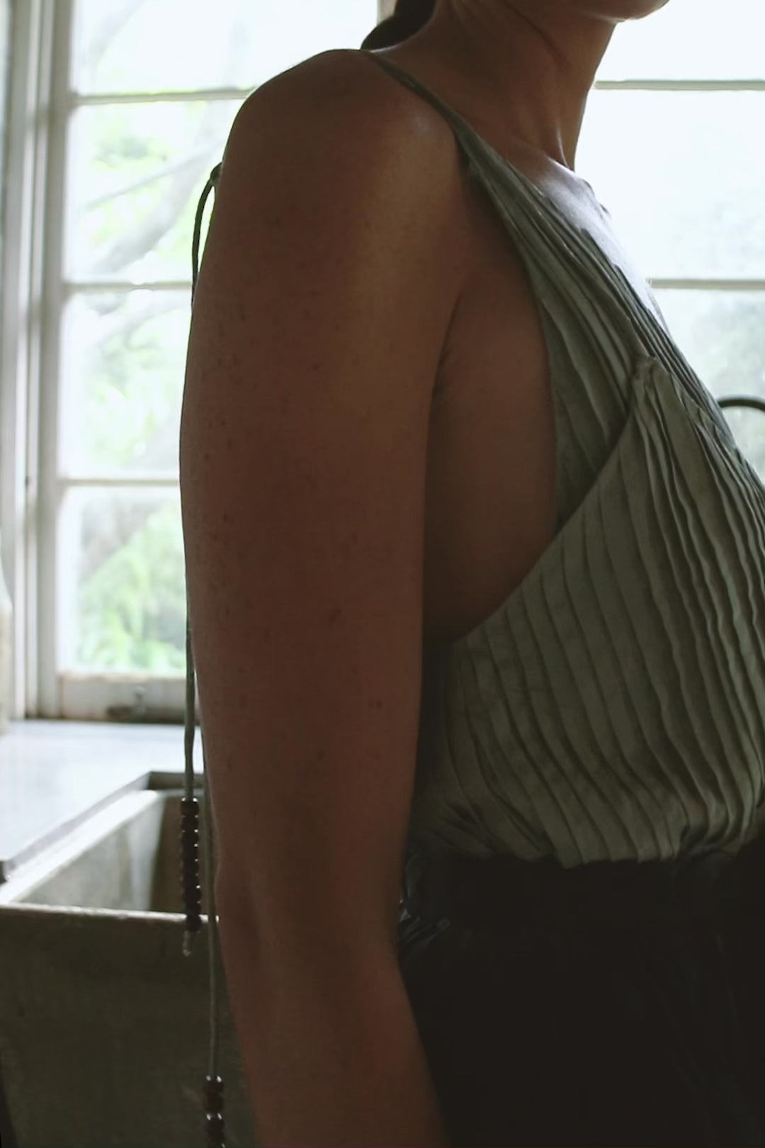 Model wearing sky blue silk cami & dress campaign film