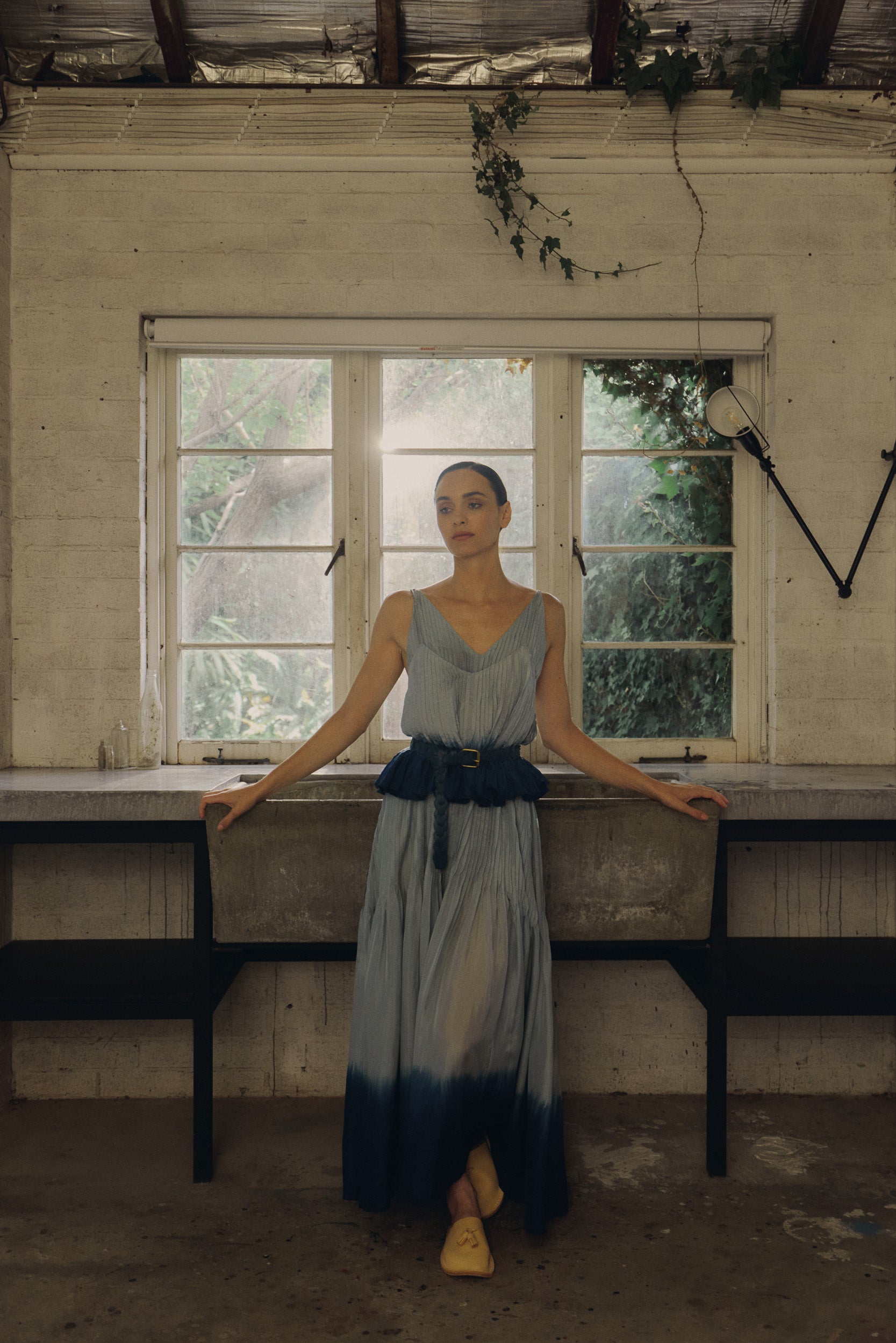 Model wearing sky blue dip-dye silk cami & dress, campaign image