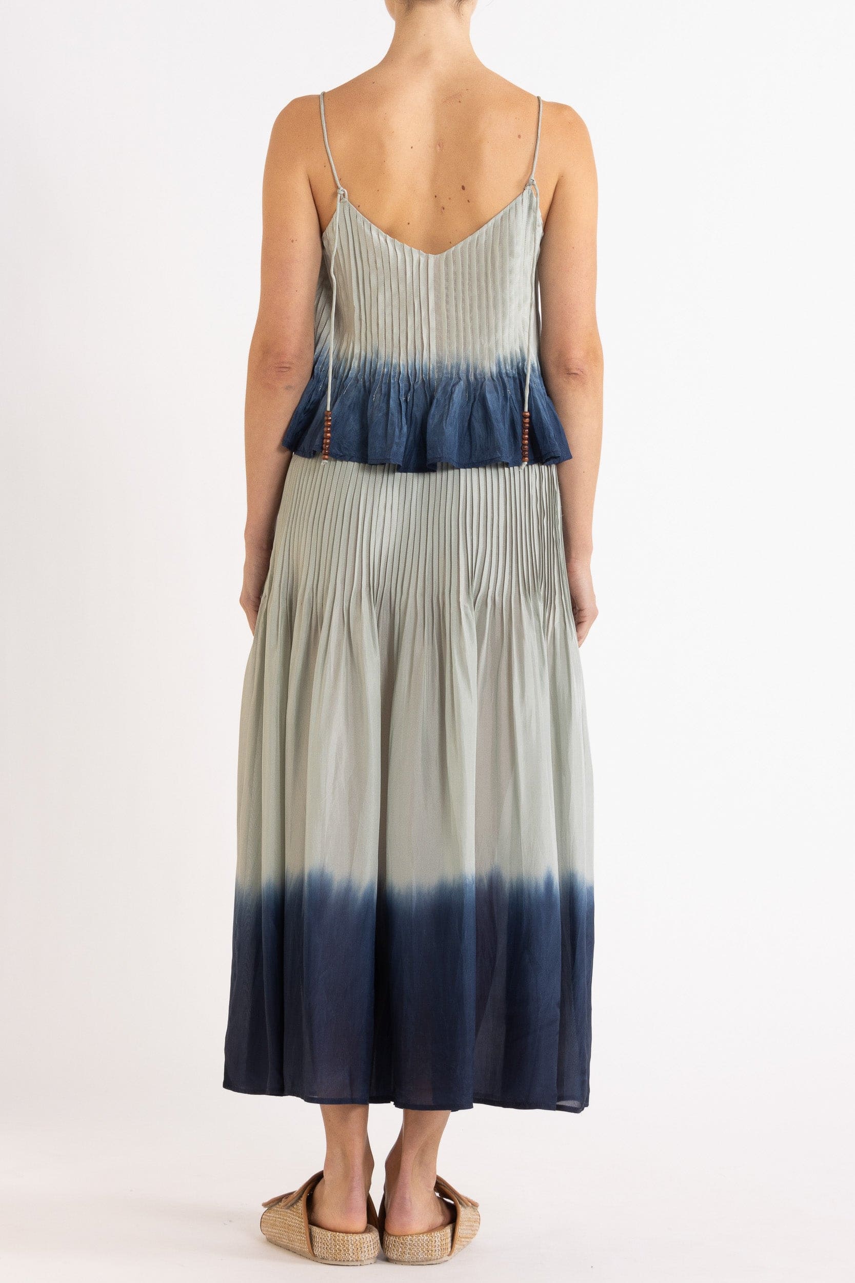 Model wearing sky blue dip-dye silk cami & skirt, back view