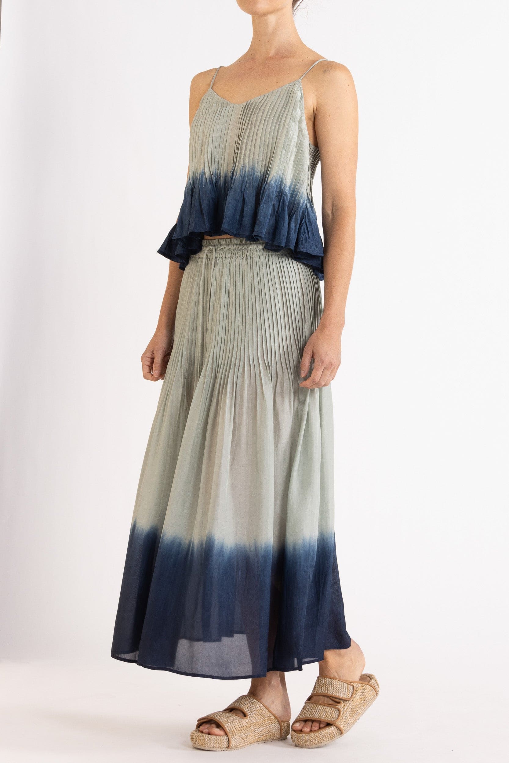 Model wearing sky blue dip-dye silk cami & skirt, front-side view