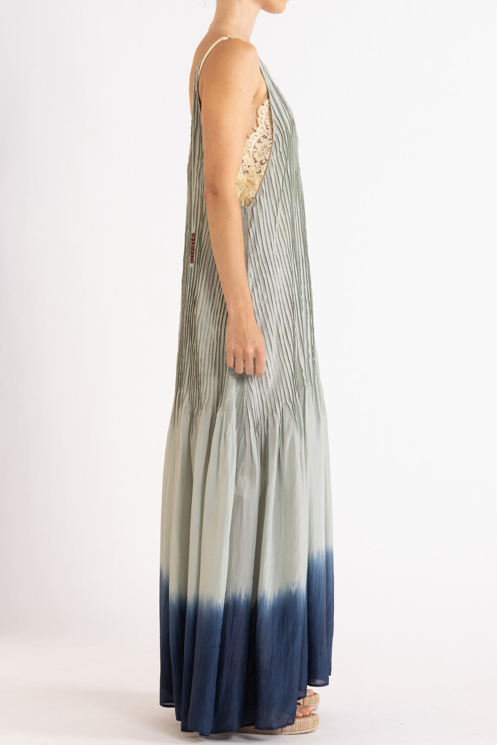 Model wearing sky blue dip-dye silk cami dress, side view