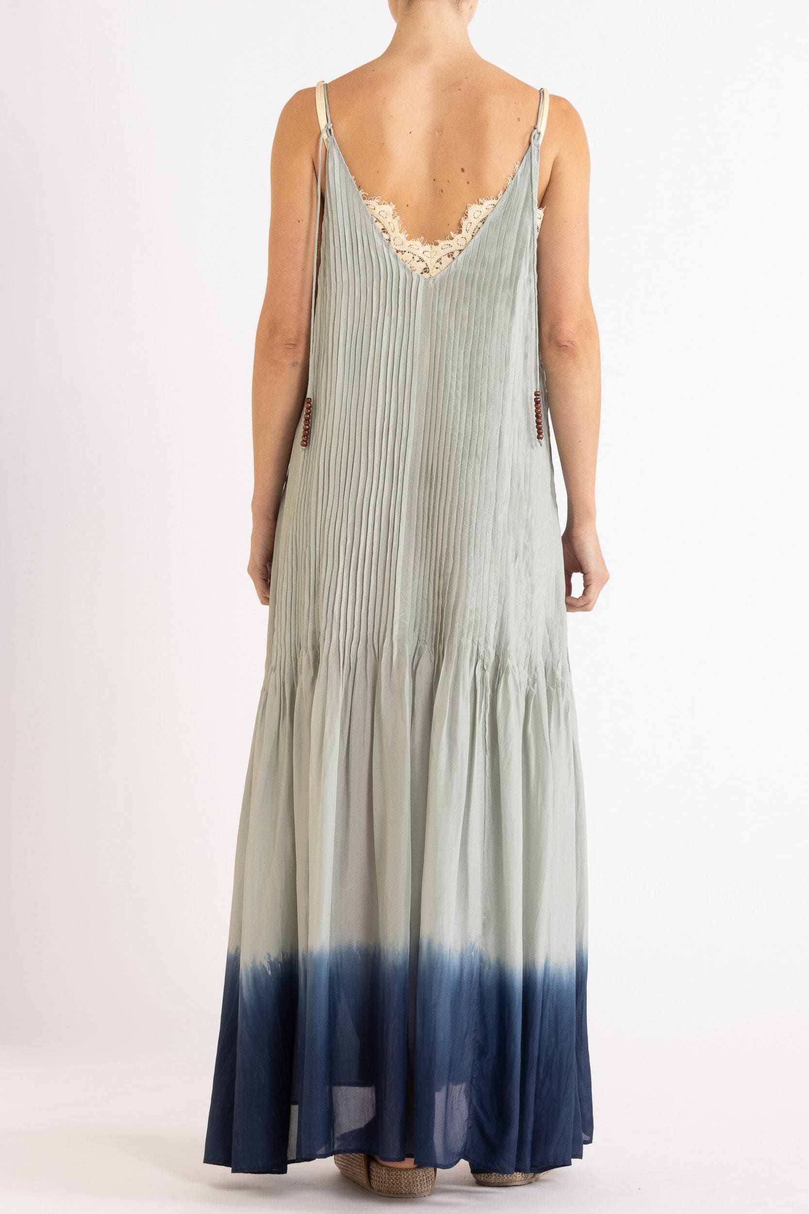 Model wearing sky blue dip-dye silk cami dress, back view