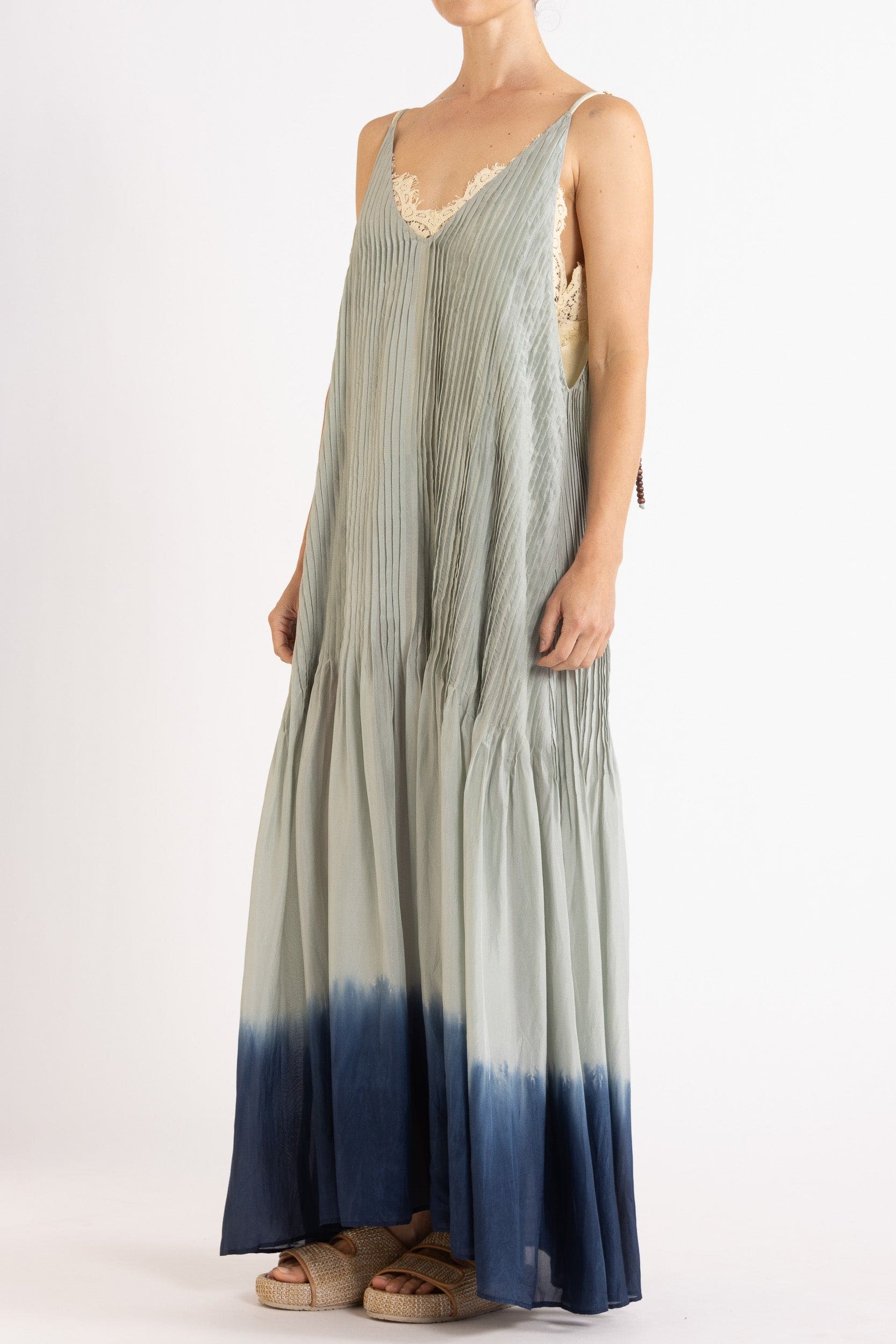 Model wearing sky blue dip-dye silk cami dress, front-side view